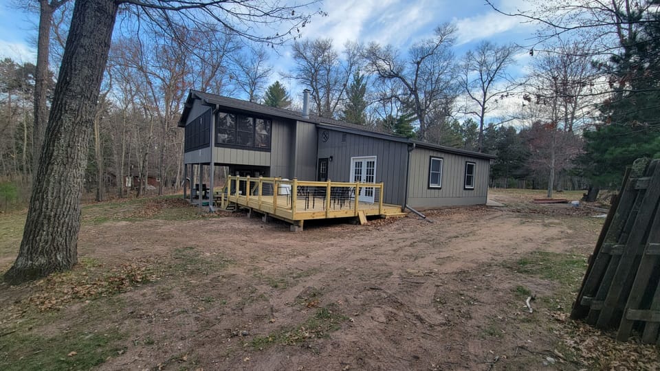 large back deck, glass screen porch, and lower patio.