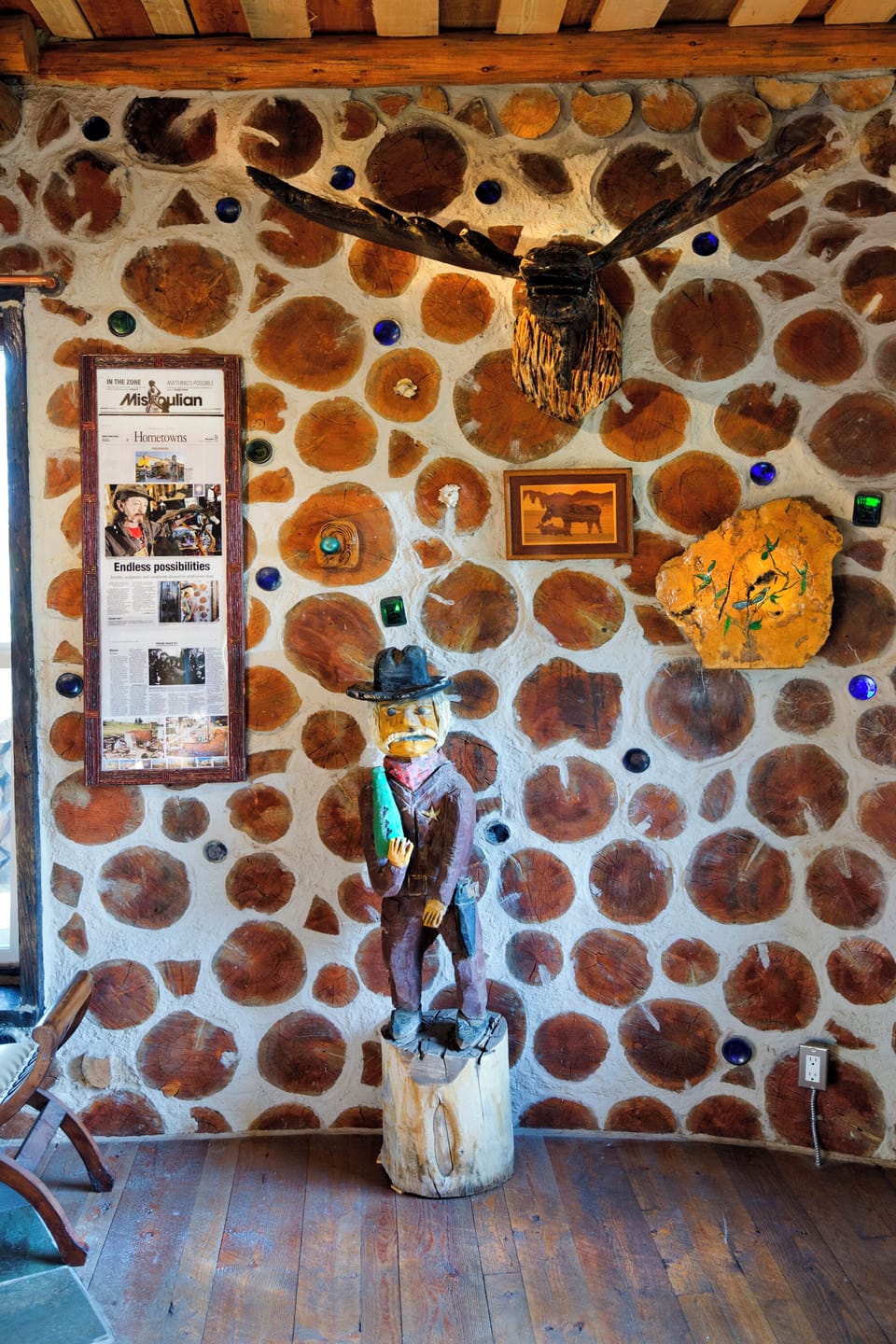 Framed Missoulian and artwork by original owners and Dave and Marczi Beaudoin.