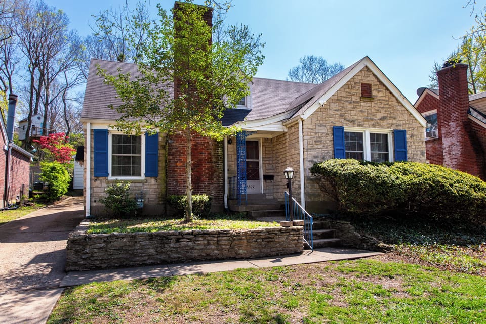 Welcome home! A classic Cape Cod with a rare 4-car private driveway.