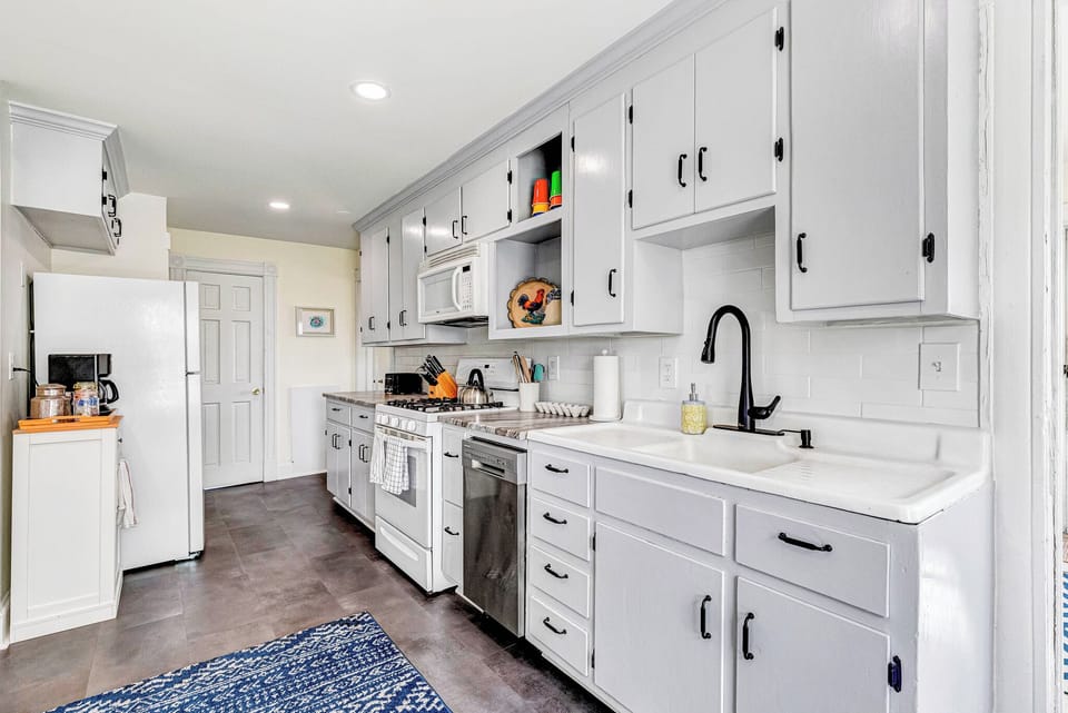 Kitchen: Cook up a feast in this sunny, stylish kitchen with modern appliances and cheerful decor!