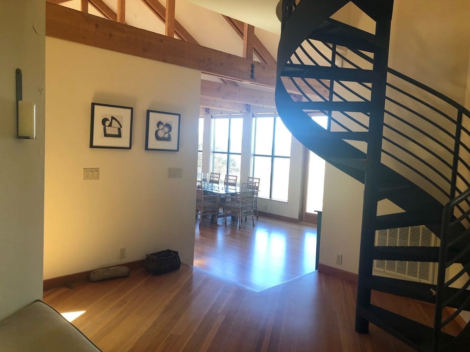 Spiral Staircase to the Loft Area with Queen Bed and Desk