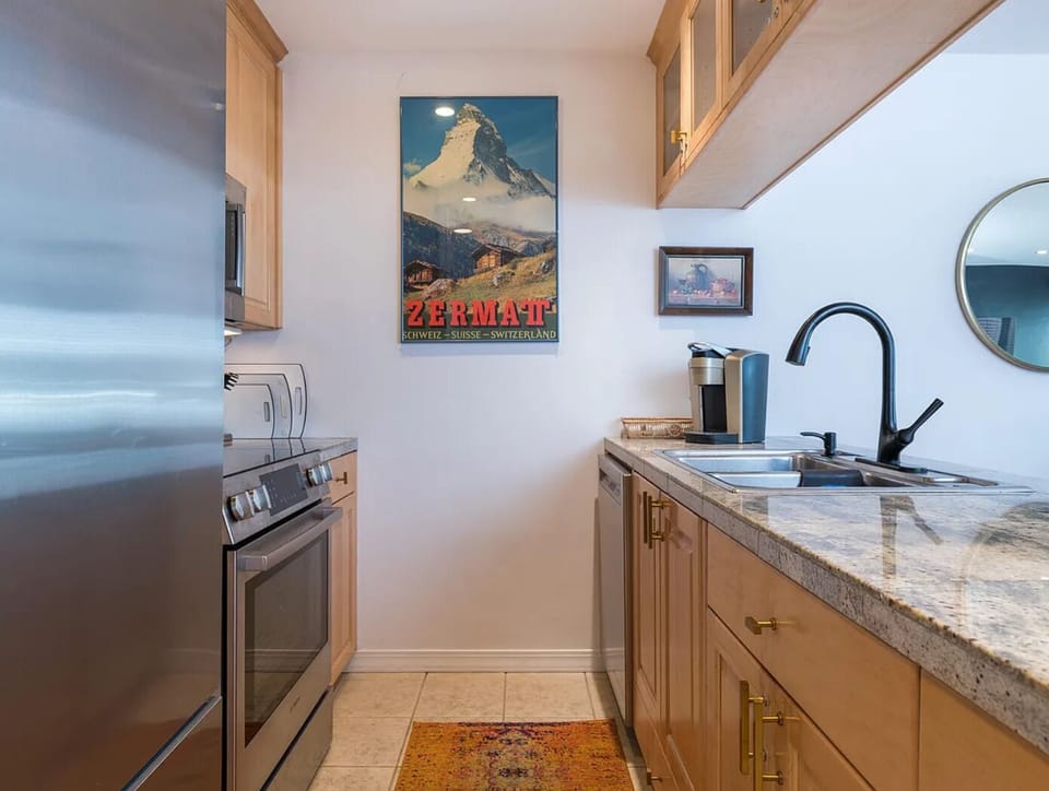 Fully stocked kitchen with oven, dishwasher, and Keurig