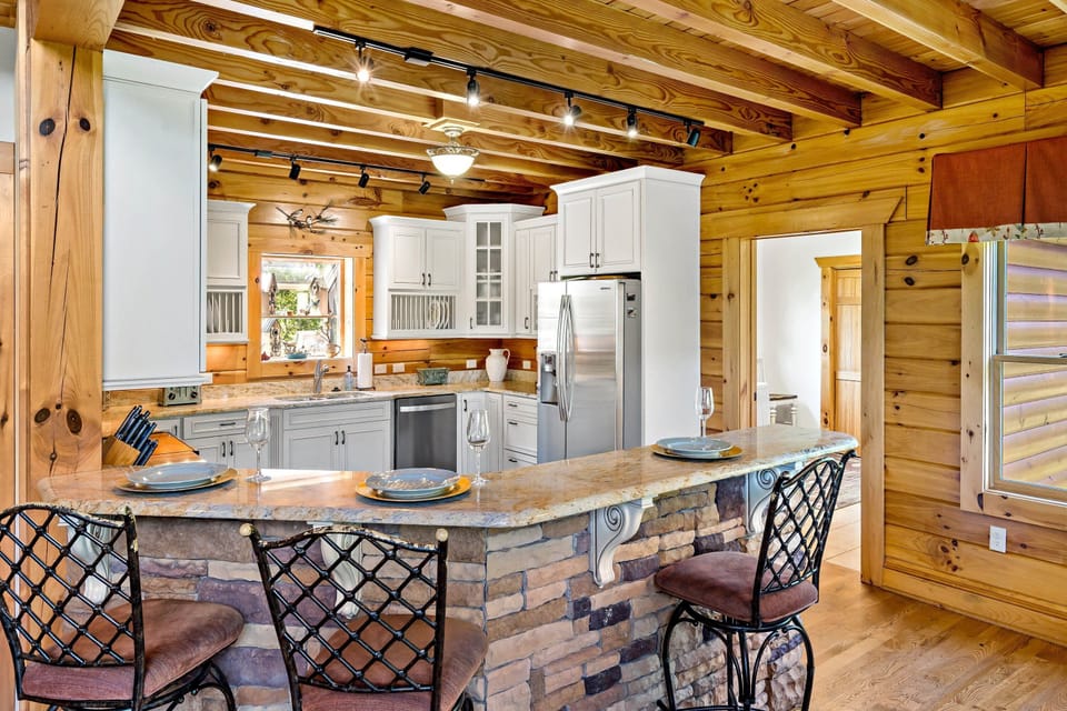 Kitchen with dishwasher, standard drip-style coffee maker, Keurig coffee maker, and coffee grinder