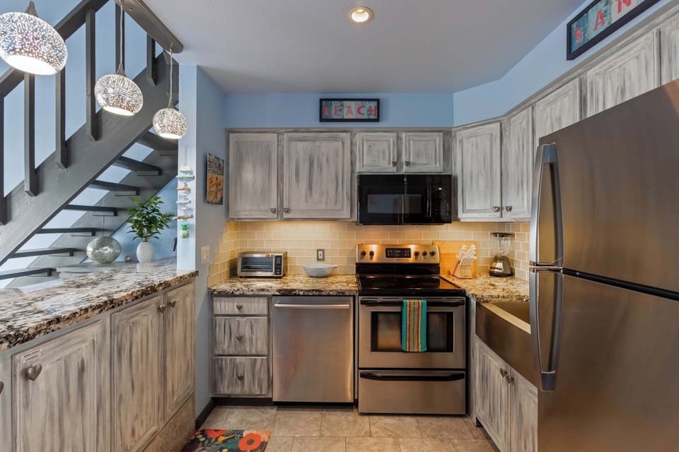 Whip up delicious meals in our fully equipped kitchen, featuring stylish appliances and ample counter space for all your culinary needs.