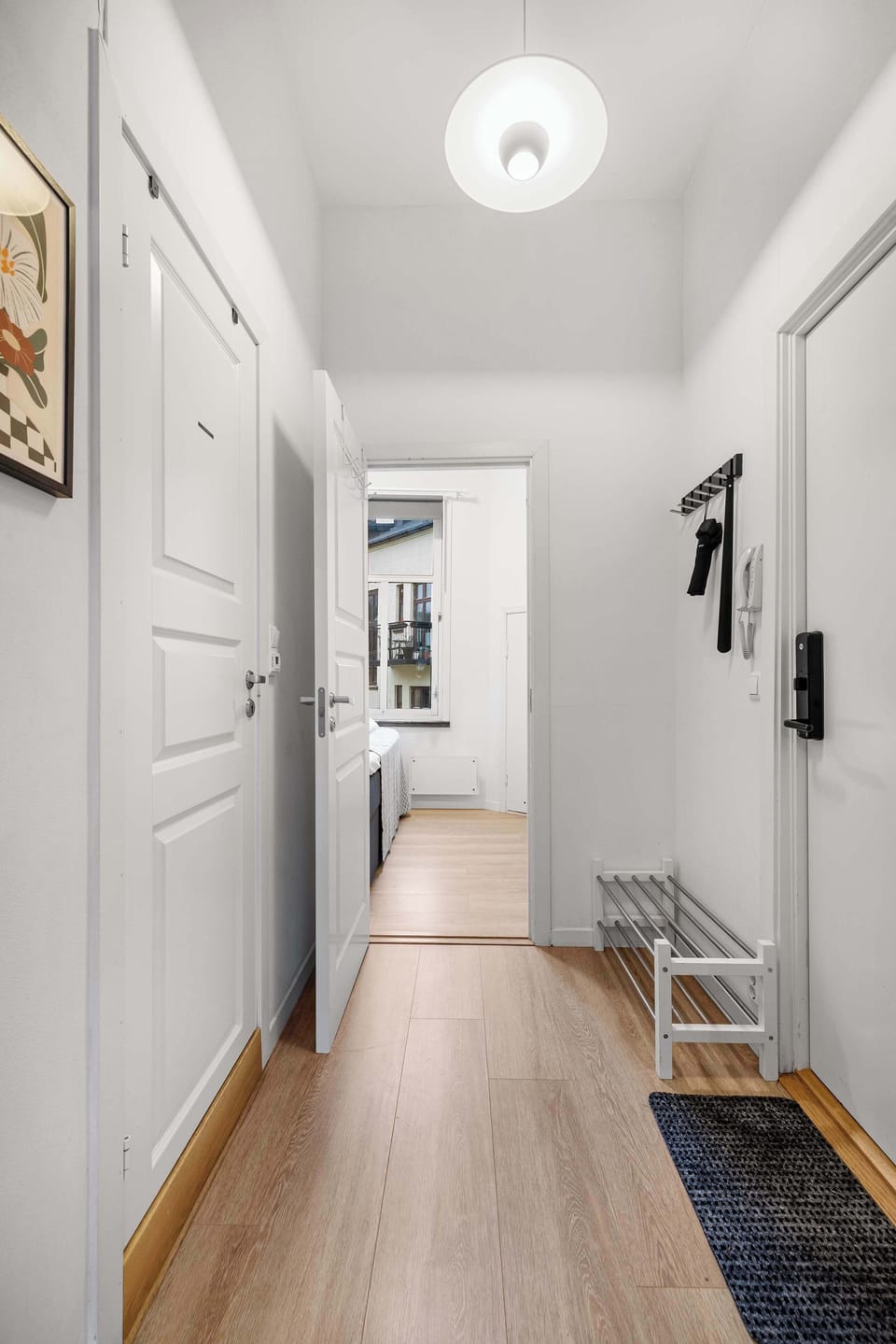 A warm and welcoming hallway leading to your cozy retreat.