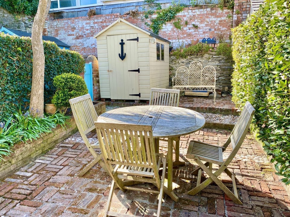 Table and chairs in back garden of Camel Cottage, in Padstow, North Cornwall