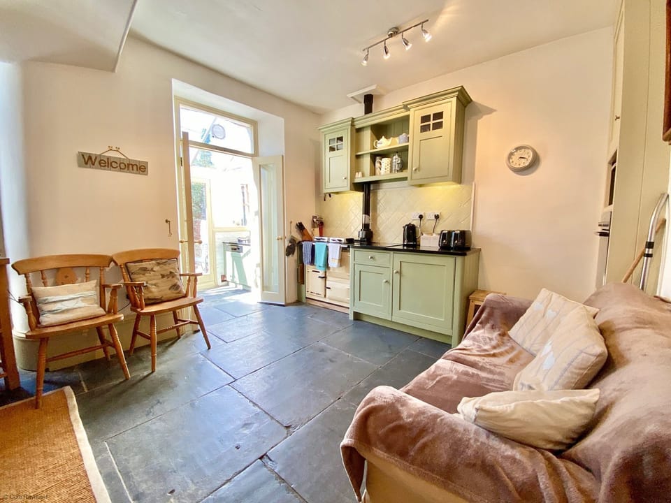 Sofa in the kitchen of Camel Cottage, in Padstow, North Cornwall