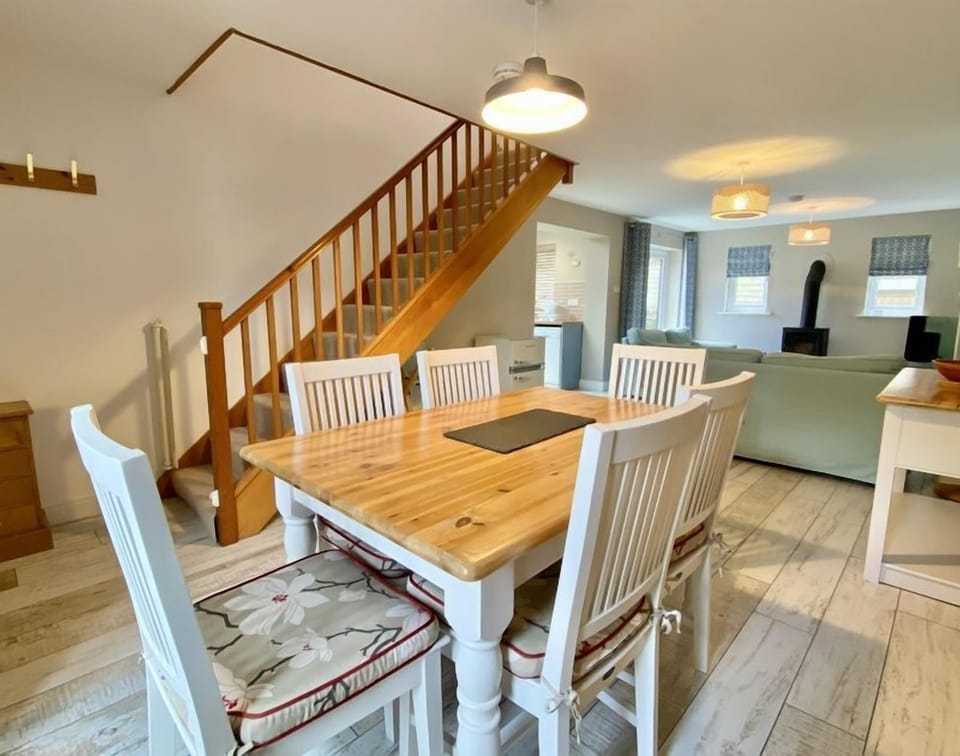 Dining area and stairs in Stowaway Holiday Cottage, Padstow, North Cornwall