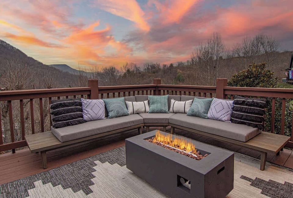 Sunset deck w/ cushioned seating & fire pit for cozy evenings outdoors