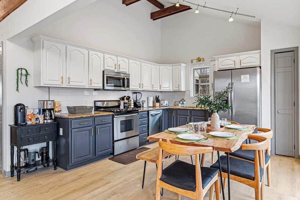 Spacious kitchen w/ large island, bar seating & open layout for gathering