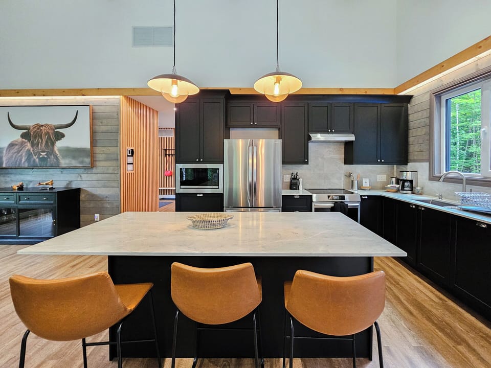 Dining area with island and stools