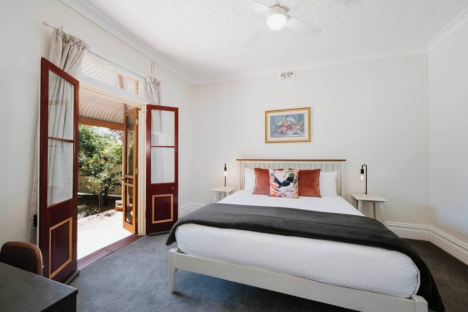 Enjoy restful nights in the first bedroom with a king-sized bed, work desk, and wardrobe to keep your space tidy.