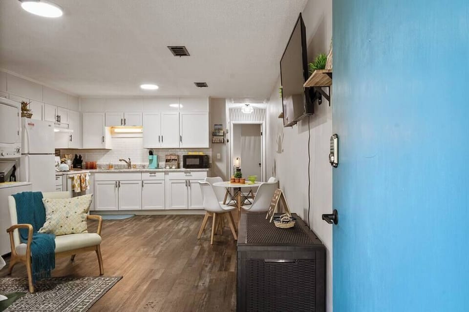 Bright kitchen w/ white cabinets, modern finishes & clean, open layout