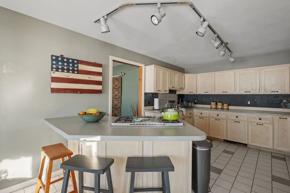 Spacious family kitchen with inviting décor and large countertops.