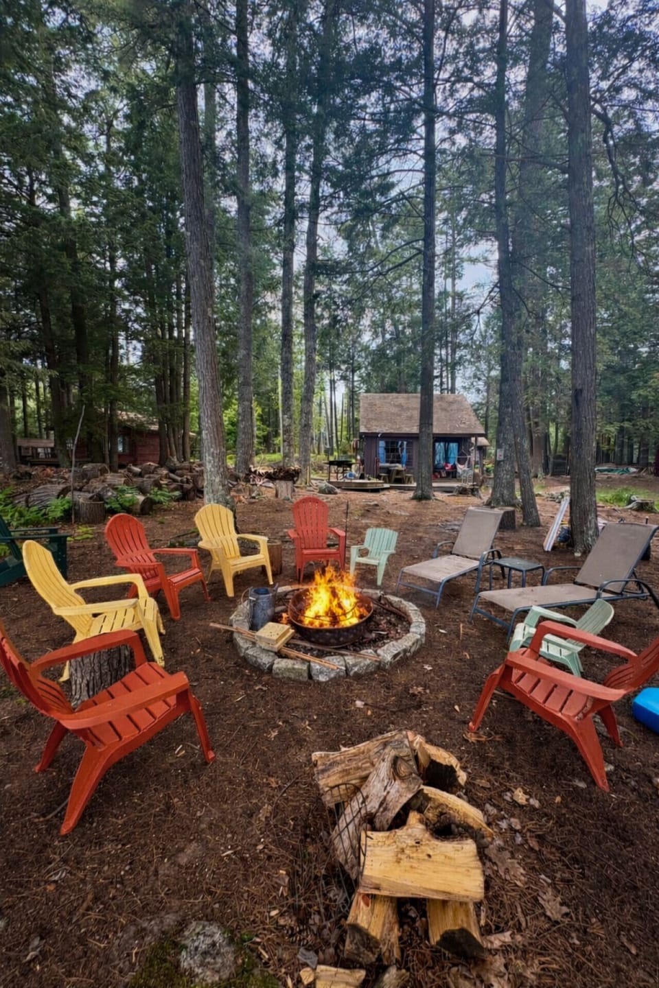 Gather around the fire pit under the trees