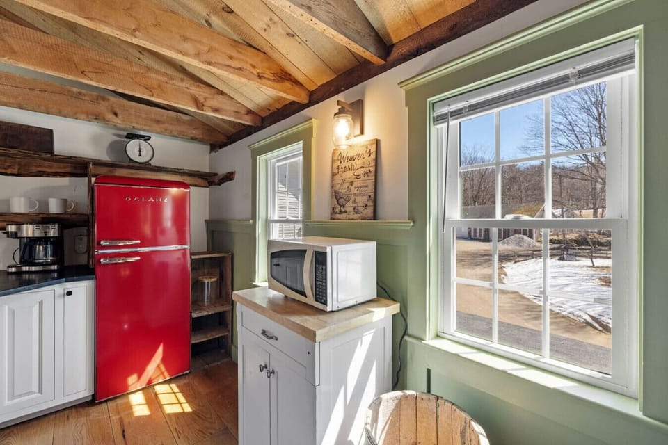 This stylish kitchen blends vintage farmhouse character with thoughtful modern upgrades