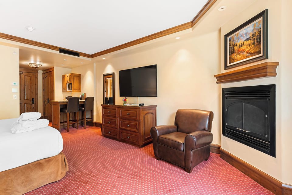 Stretch out in this spacious suite with fireplace and big TV.