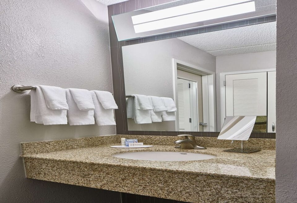 Refresh under bright lights with a clean, spacious vanity.