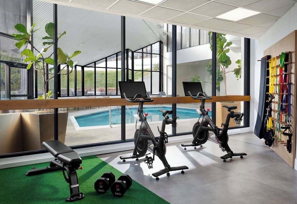 Energize your morning workout with inspiring poolside views.