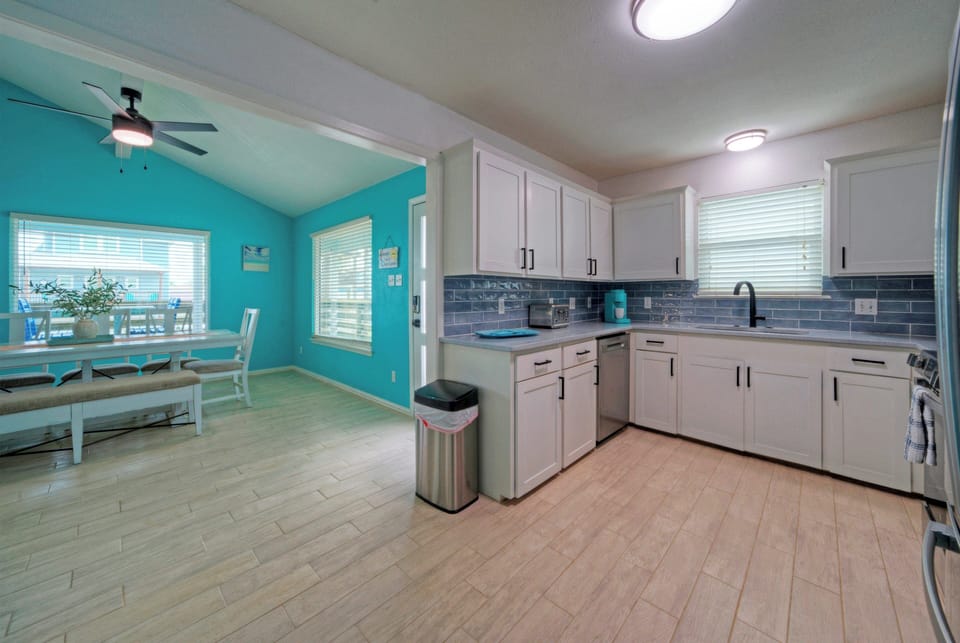 Fully equipped kitchen with open dining area.