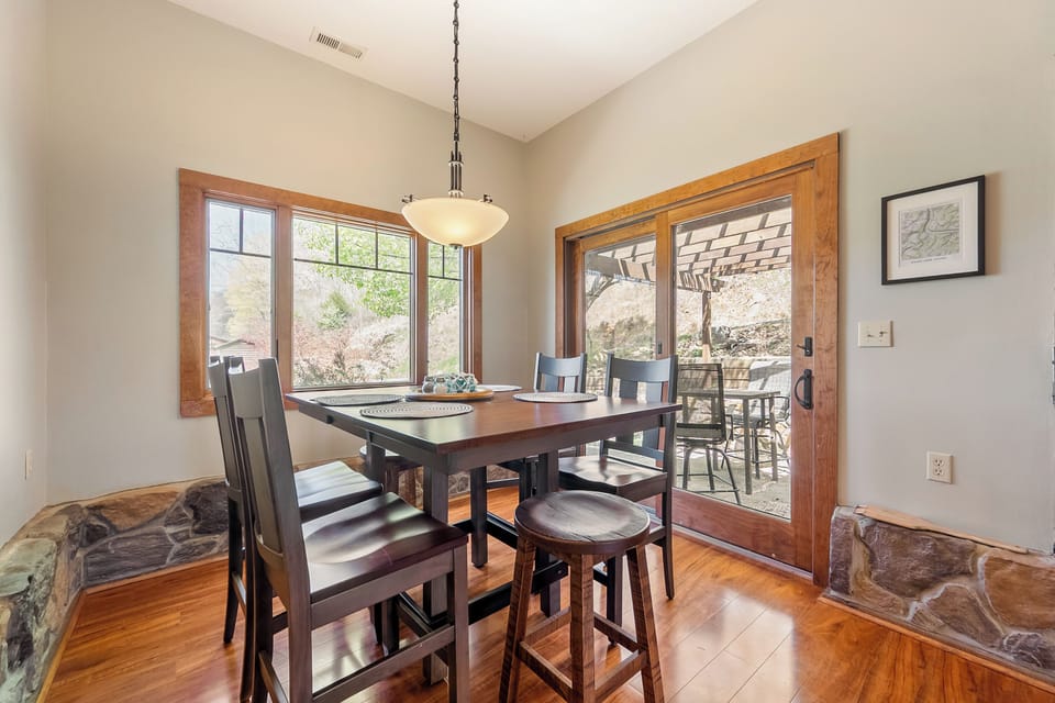 Bright dining nook with scenic views and easy outdoor access.
