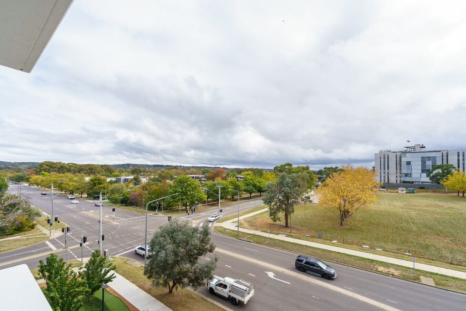 Enjoy a tranquil view from the balcony, with a charming street view and open fields that provide a relaxing, natural atmosphere.