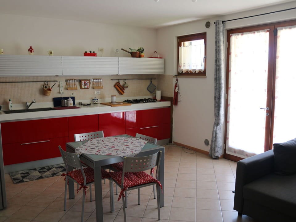 Furniture, Flooring, Interior Design, Kitchen, Wood, Floor, Countertop, Kitchen Appliance, Chair, Major Appliance