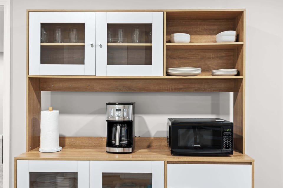 Kitchen: Start your day right with a hot cup of coffee or heat up leftovers with ease—everything you need is right here.