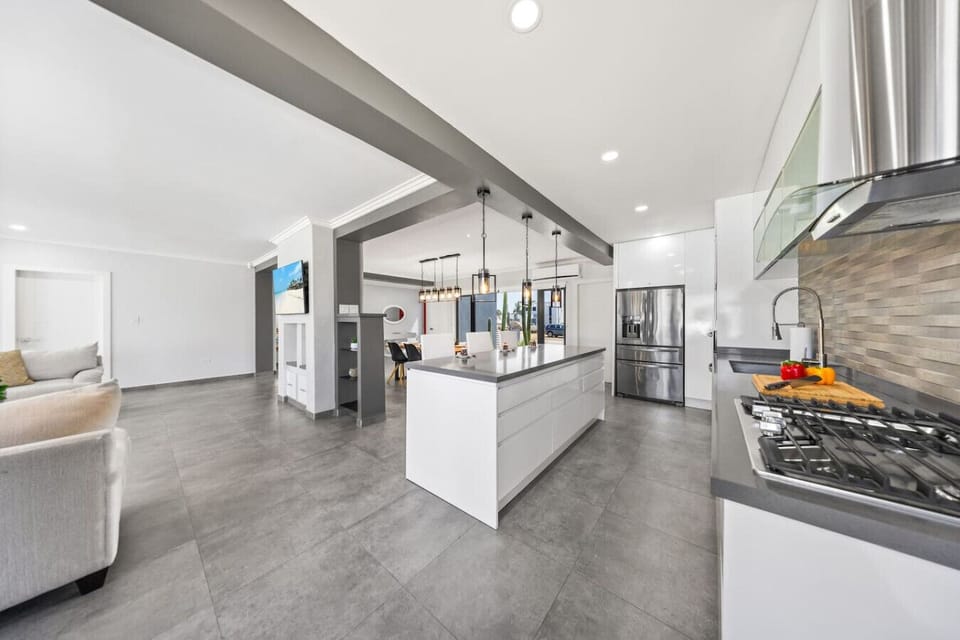 Practical kitchen with clean white finishes.