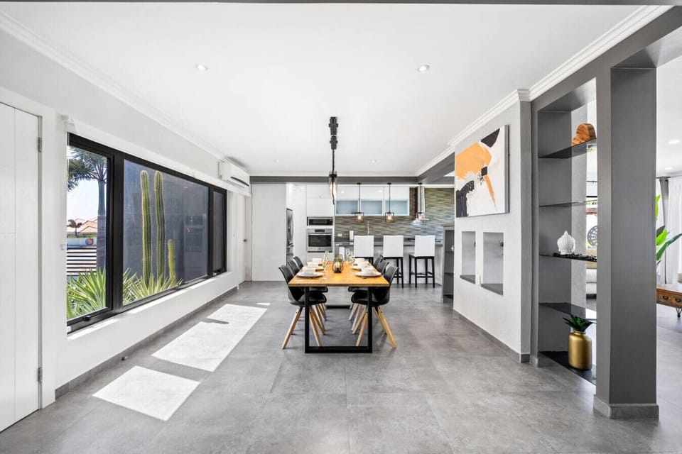 Open, bright living and kitchen area with cozy seating.