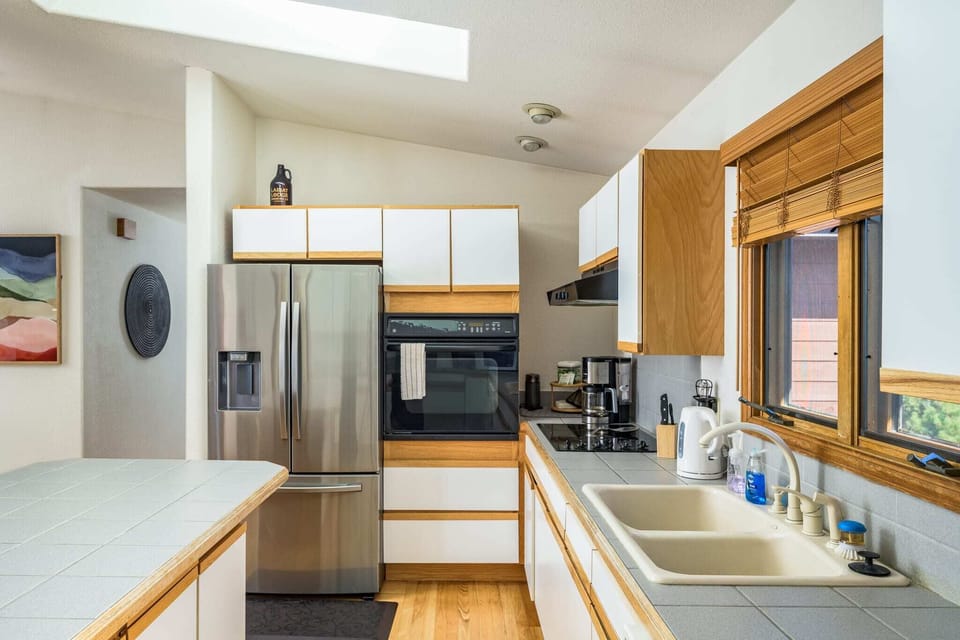 The fully equipped kitchen upstairs.