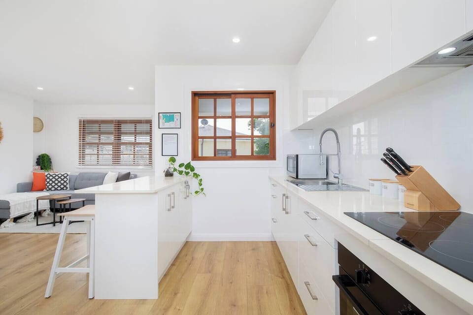 The well-equipped kitchen is perfect for preparing everything from lazy breakfasts to casual dinners, with a Nespresso machine, pour-over coffee setup, microwave, stove, oven and all the essentials at your fingertips.