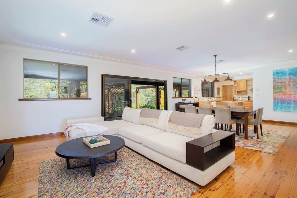 Step into the main living area, where an L-shaped sofa and TV invite you to unwind of a long day of exploring the region.