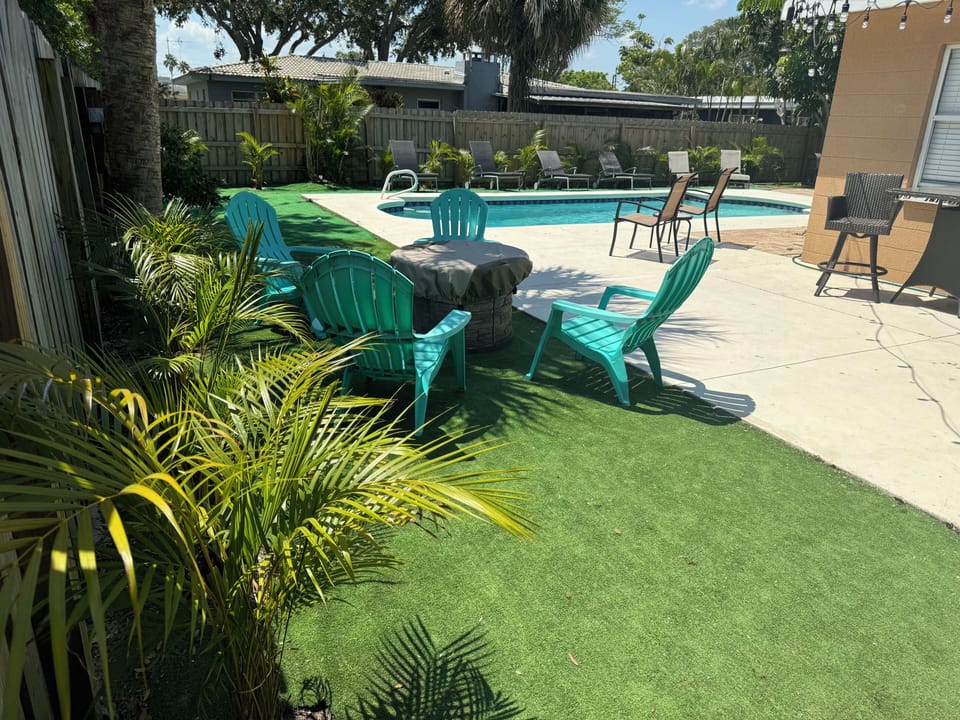 Serene backyard space, fully fenced, with pool, fire pit, tiki bar