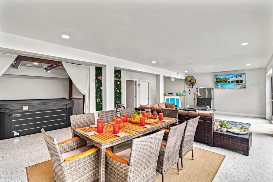 View of Hot Tub with Privacy Curtains 8 Seat Outdoor Dining Room Table, Ice Machine and Smart TV