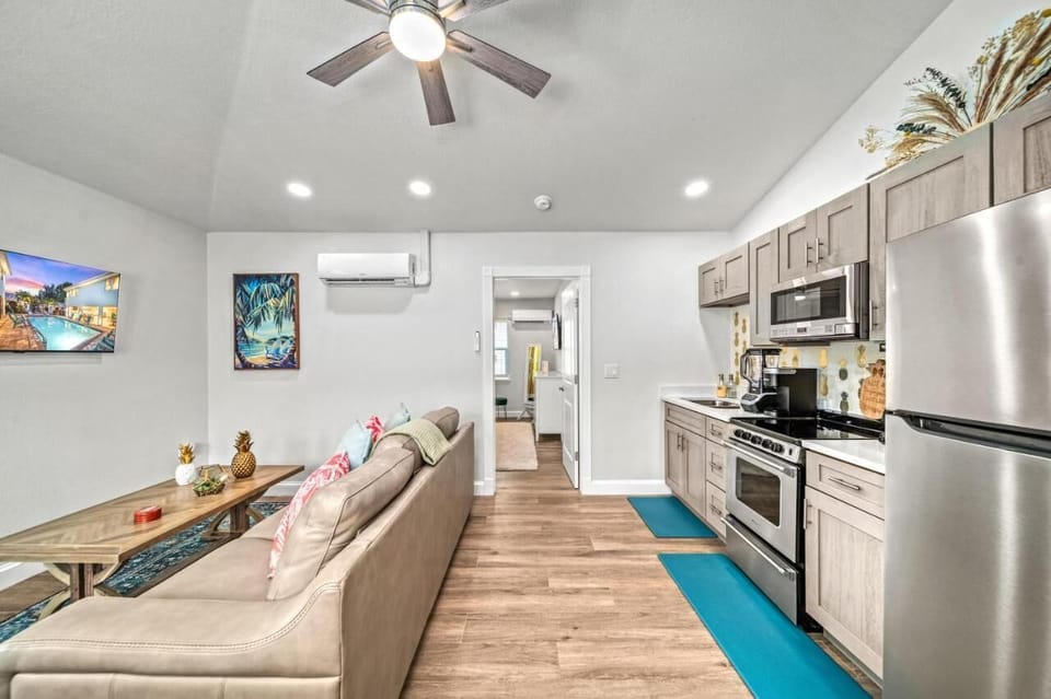 Living Room: Bright and airy space with stylish decor, perfect for relaxation after beach adventures!

