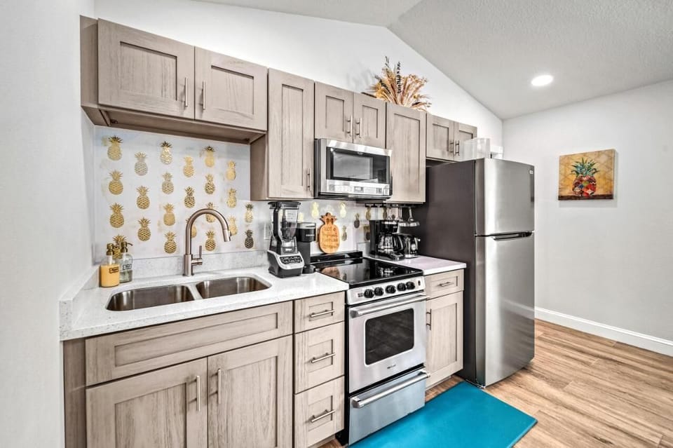 Kitchen Delight: Whip up culinary magic in this stylish kitchen with chic pineapple accents!


