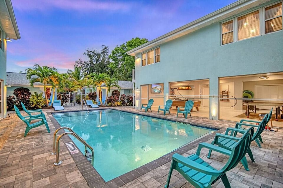 Pool at Dusk with View of Out door Dining Room & Hot Tub AreaPool at Dusk with View of Out door Dining Room & Hot Tub Area