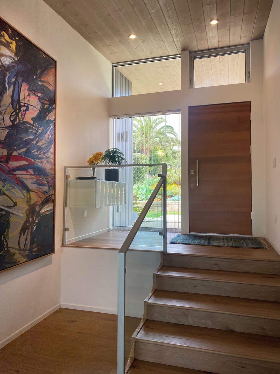 Stairs from front door to living area