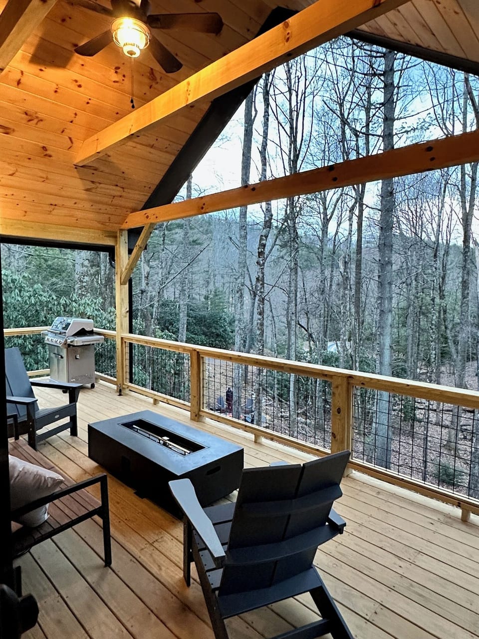 Upper grand deck with fire table and gas grill