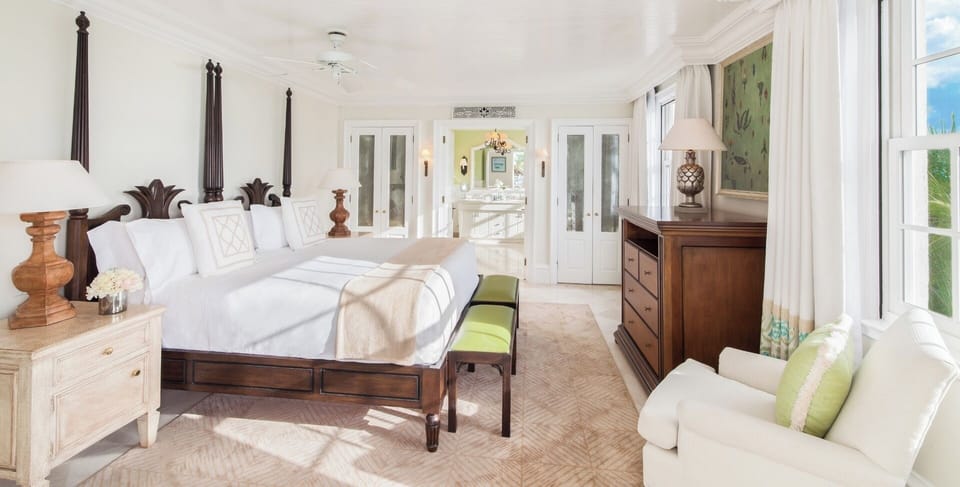 Unwind in a spacious bedroom with airy coastal elegance.