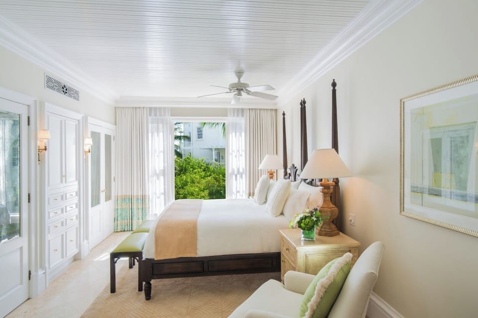Drift off in crisp linens with tranquil garden-facing light.