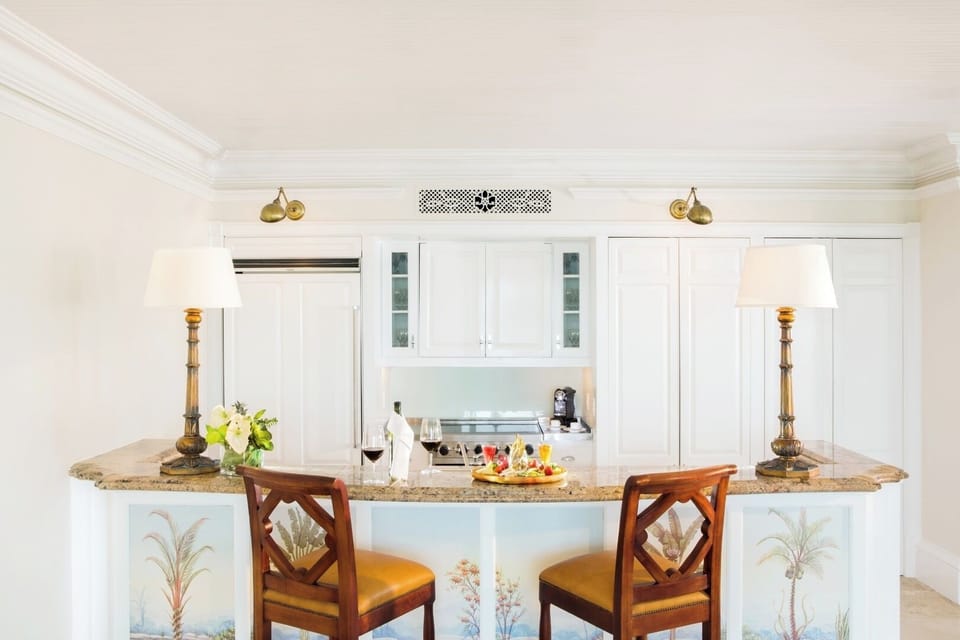 Sip and snack at the elegant bar in a bright kitchen.