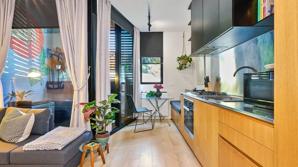 A stylish and modern living space with a cozy kitchen nook 
