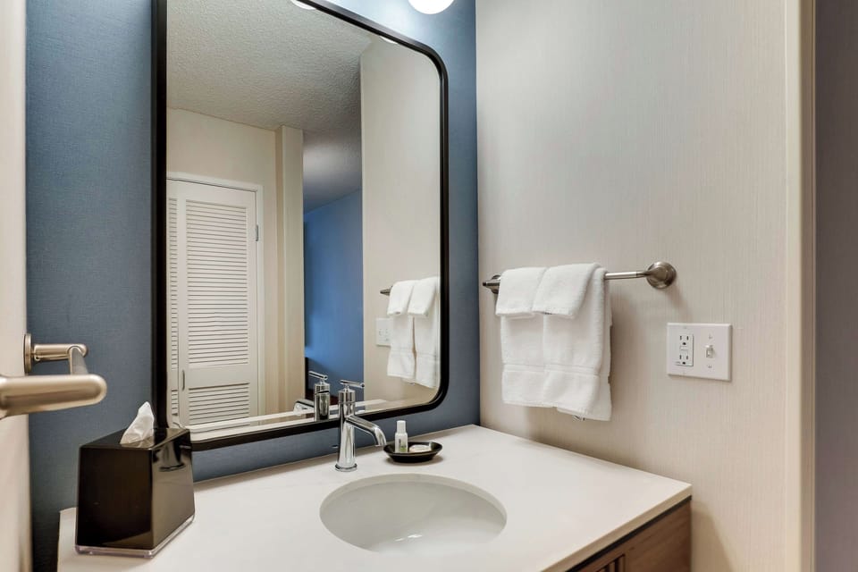 Refresh at a spotless vanity with soft, fluffy towels.