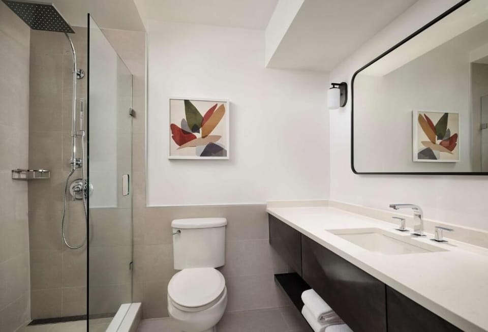 Rinse off comfortably with rainfall shower and bright vanity lighting.