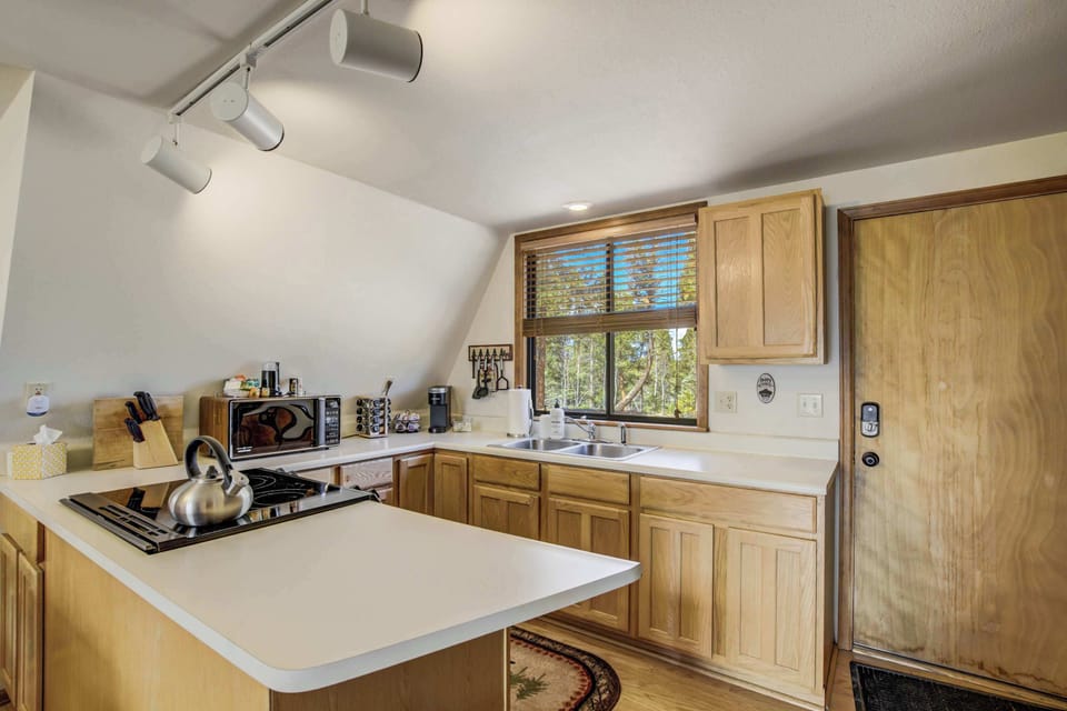 Whip up delicious meals in the fully equipped kitchen, complete with modern appliances, a gas cooktop, and all the essentials you need for cooking in comfort among the pines.








