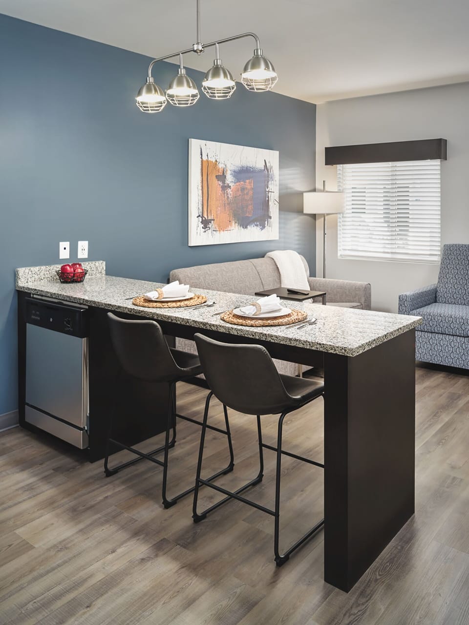 Gather for relaxed meals at the granite counter with seating.