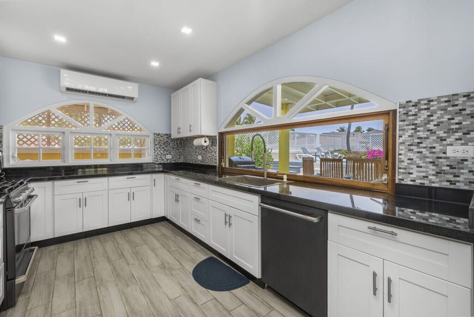 This is the kitchen in the main house, where style meets functionality for all your culinary adventures!