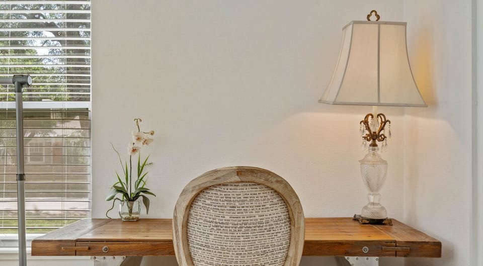Plan adventures or stay connected—this workspace has a desk, natural light, and plenty of charm!